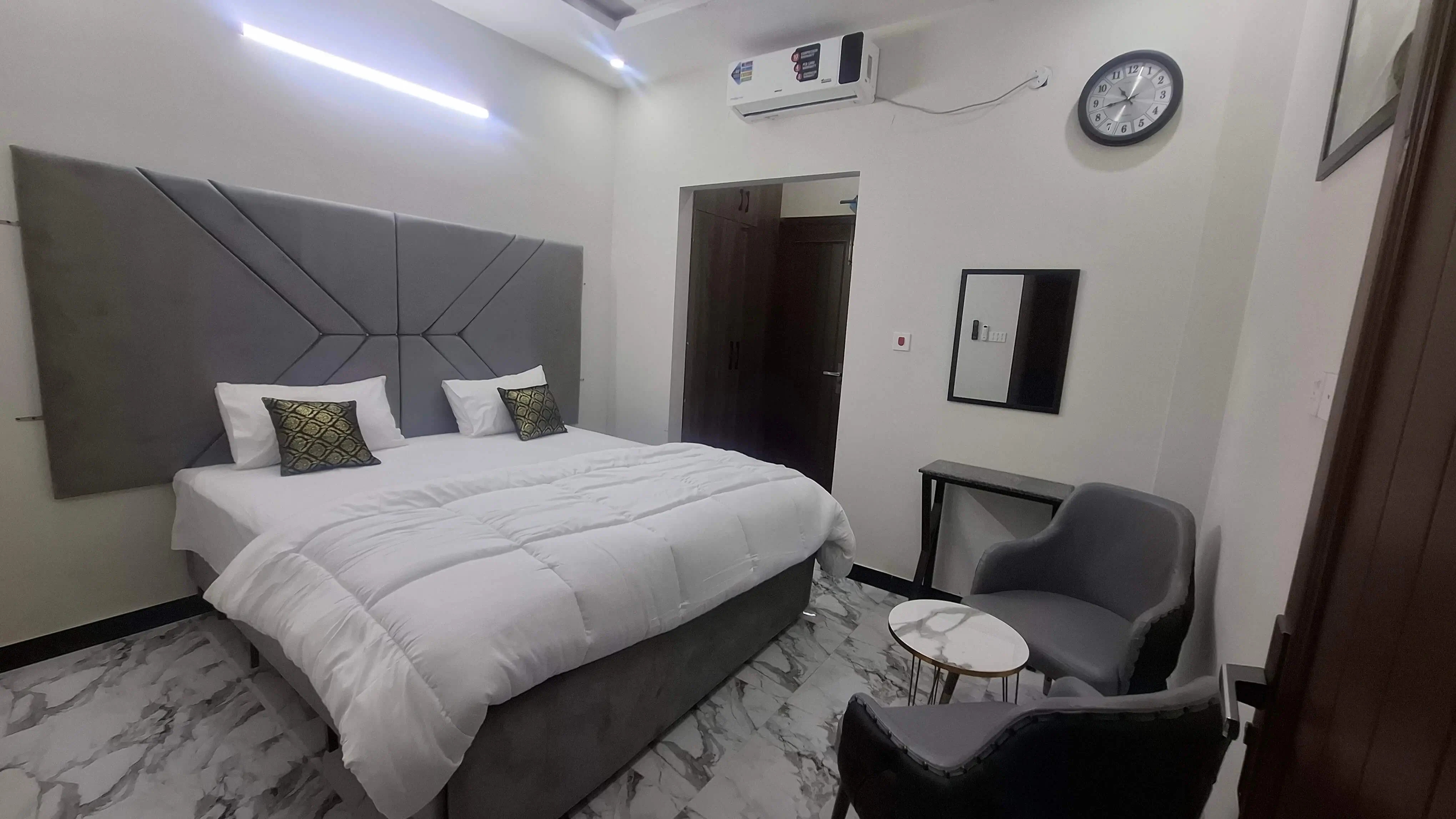 A clean and classy grey finish room.
